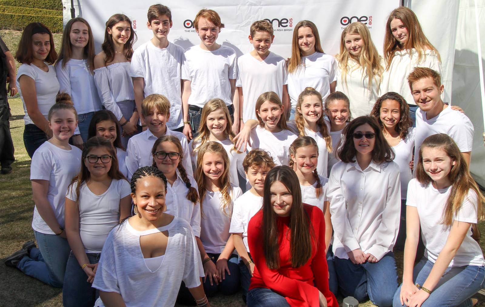 Local students sing to support disaster victims