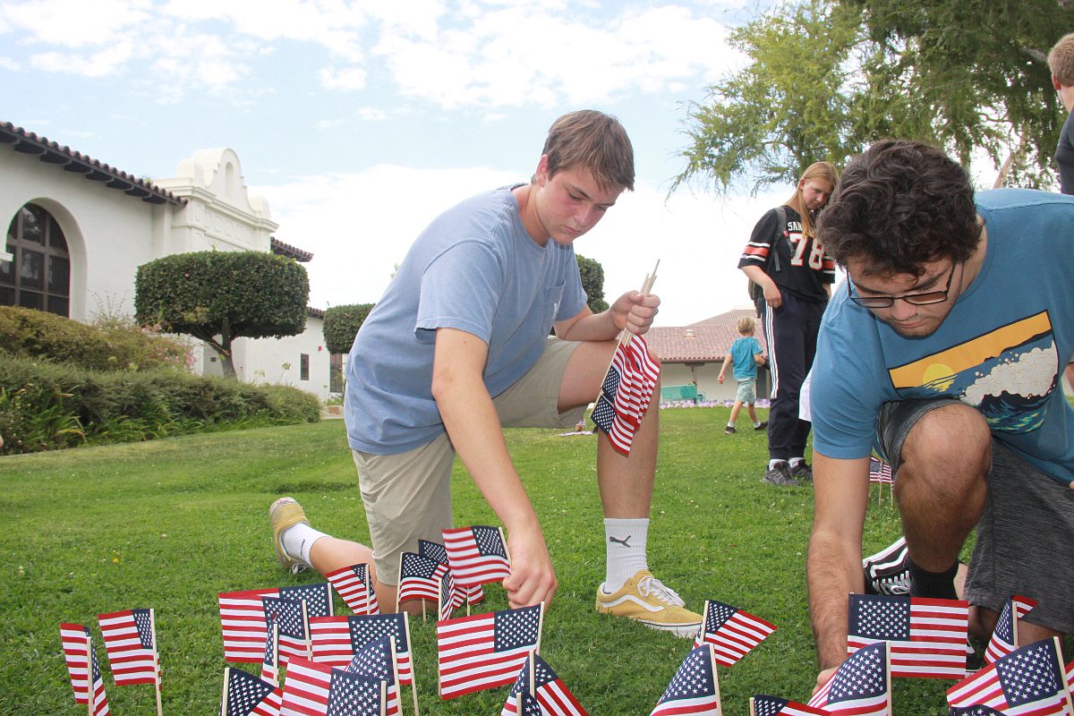Local students place flags to honor 9/11 tragedies