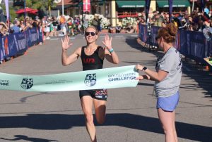 Amanda Lankford of Simi Valley crosses the finish line as the top women's finisher of the Santa Barbara Wine Country Half Marathon in Solvang on May 10. Lankford's winning time was 1:30:46.12. Photo by Mike Chaldu/SYVS
